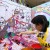 A girl plays the game of "Angry Birds" during the 1st Children At Play Festival in Suzhou, east China's Jiangsu Province, June 2, 2012.