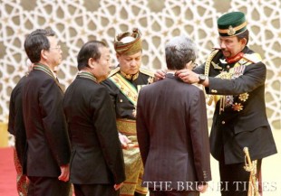 His Majesty the Sultan and Yang Di-Pertuan of Brunei Darussalam (R) presenting the Most Distinguished Order of Paduka Seri Laila Jasa (DSLJ) - 2nd Class, to Watanabe (2nd R), Nikai (3rd L), Ken (2nd L) and Tan Sri Dato' Sri Haji Arshad Ayob (L-hidden), during the Investiture ceremony at Istana Nurul Iman. Picture: BT/Saifulizam