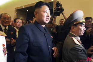 North Korean leader Kim Jong Un, center, flanked by Yang Hyong Sop, Vice President of the Presidium of North Korea's parliament to his left tours the newly opened Fatherland Liberation War Museum, Saturday, July 27, 2013 as part of celebrations for the 60th anniversary of the Korean War armistice in Pyongyang, North Korea.(AP Photo/Wong Maye-E)