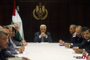 Palestinian President Mahmoud Abbas, center, chairs a session of the Palestinian cabinet in the West Bank city of Ramallah, July 28, 2013. U.S. Secretary of State John Kerry shuttled between Israeli and Palestinian leaders for months seeking a breakthrough and announced last week that the Palestinians and the Israelis were willing to meet to discuss renewing talks. The Palestinians long refused to return to the negotiating table unless Israel agreed to several preconditions. (AP Photo/ Xinhua, Issam Rimawi, Pool)