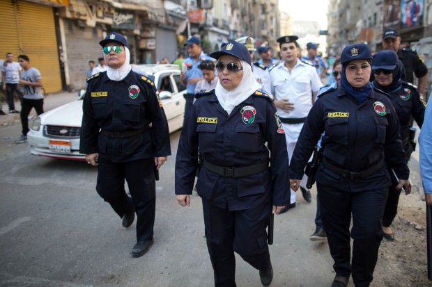 Egyptian policewomen who are part of a new anti-harassment force patrol in Cairo on the first day of Eid Al-Fitr, Friday, July 17, 2015. The force is a new initiative by the Ministry of Interior to combat sexual harassment in the streets, which in past years has spiked in Cairo during the holiday celebrations with the crowds of rowdy men in the streets (AP Photo/Roger Anis)