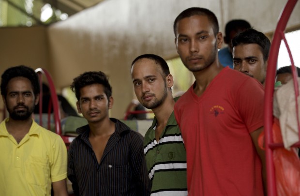 A group of migrants from Nepal stand inside a shelter. (AP Photo/Arnulfo Franco) 