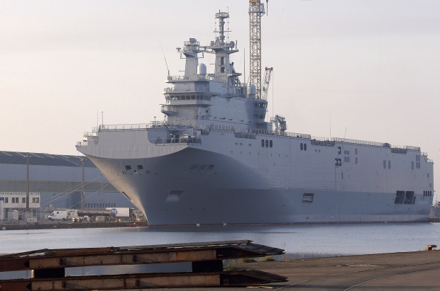 the Vladivostok warship, the first of two Mistral-class helicopter carriers ordered by Russia, docks on the port of Saint-Nazaire, western France. (AP Photo/David Vincent, File) 