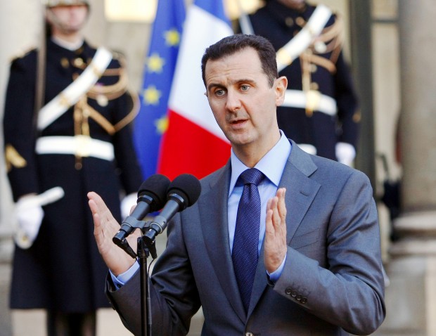  In this Thursday Dec. 9, 2010 file photo, Syria President Bashar al-Assad addresses reporters following his meeting with French President Nicolas Sarkozy at the Elysee Palace in Paris, France. Paris prosecutors have opened a preliminary investigation into French government accusations that Syrian President Bashar Assad's government has committed crimes against humanity. The prosecutor's office said Wednesday the investigation is based on photos taken by a former Syrian officer who fled in 2013 and focuses on atrocities allegedly committed between 2011 and 2013. (AP Photo/Remy de la Mauviniere, File) 