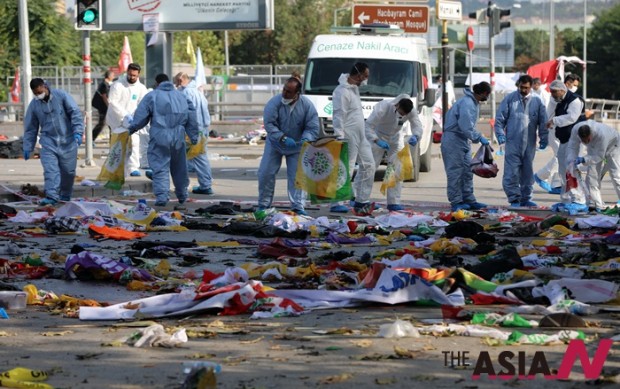 Police forensic officers at the site of an explosion in Ankara, Turkey, Saturday, Oct. 10, 2015. Two nearly simultaneous explosions targeted a Turkish peace rally Saturday by Kurdish activists and opposition supporters in Ankara. At least 86 people were killed and nearly 190 wounded in what appeared to be suicide attacks, Turkish officials said. The explosions occurred seconds apart outside the capitals main train station as hundreds gathered for the rally, organized by Turkeys public workers union and other civic society groups.The rally aimed to call for increased democracy and an end to the renewed violence between Kurdish rebels and Turkish security forces.(AP Photo/Burhan Ozbilici)   