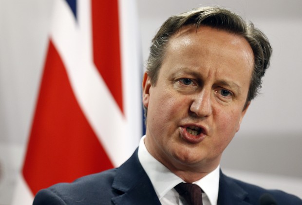 British Prime Minister David Cameron as he speaks during a media conference at the conclusion of the Eastern Partnership summit in Riga, Latvia. An influential group of lawmakers says launching British airstrikes against Islamic State group militants in Syria would be "incoherent" and ineffective without a plan to end the country's civil war. (AP Photo/Mindaugas Kulbis, File) 