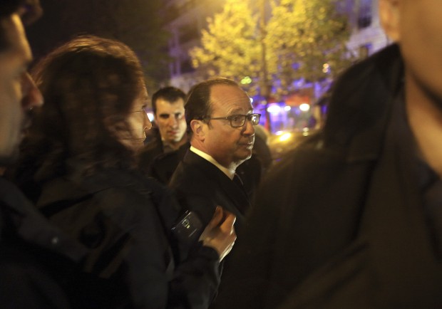 French President Francois Hollande arrives to visit the site of the the Bataclan theater after a shooting in Paris, Friday Nov. 13, 2015.  (AP Photo/Thibault Camus)