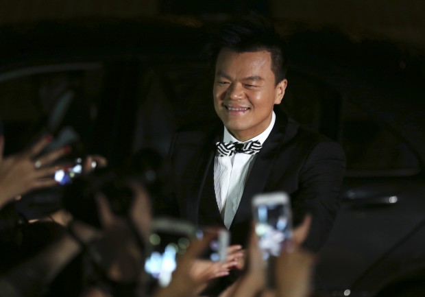 South Korean musician Park Jin-young walks on the red carpet of the 2015 Mnet Asian Music Awards (MAMA) in Hong Kong, Wednesday, Dec. 2, 2015. (AP Photo/Kin Cheung)