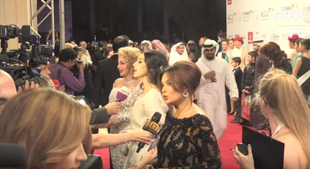 Hend Sabry, one of the stars at DIFF giving an interview on the red carpet, along other Arab actresses such as Leila Alwyi and others.