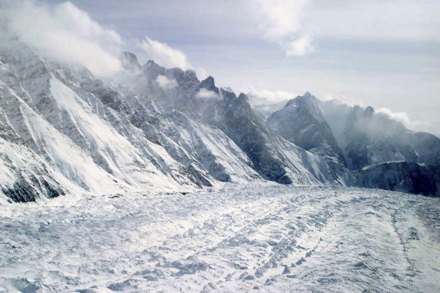 This Feb. 1, 2005 file photo shows an aerial view of the Siachen Glacier, which traverses the Himalayan region dividing India and Pakistan, about 750 kilometers (469 miles) northwest of Jammu, India. An avalanche hit the Siachen Glacier in the Indian-controlled portion of Kashmir early Wednesday,Feb.3, 2016 trapping 10 Indian army soldiers in the snow. (AP Photo/Channi Anand, File)