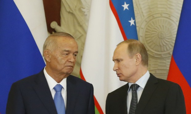 Russian President Vladimir Putin, right, speaks to Uzbek President Islam Karimov at a signing ceremony following their meeting in the Kremlin in Moscow, Russia, Tuesday, April 26, 2016. (Maxim Shemetov/Pool Photo via AP)