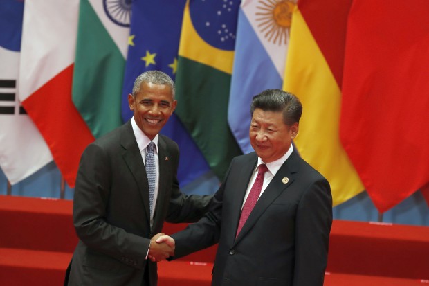 U.S. President Barack Obama, left, shakes hands with China's President Xi Jinping before a group photo session for the G20 Summit in Hangzhou in eastern China's Zhejiang province, Sunday, Sept. 4, 2016. (AP Photo/Ng Han Guan)