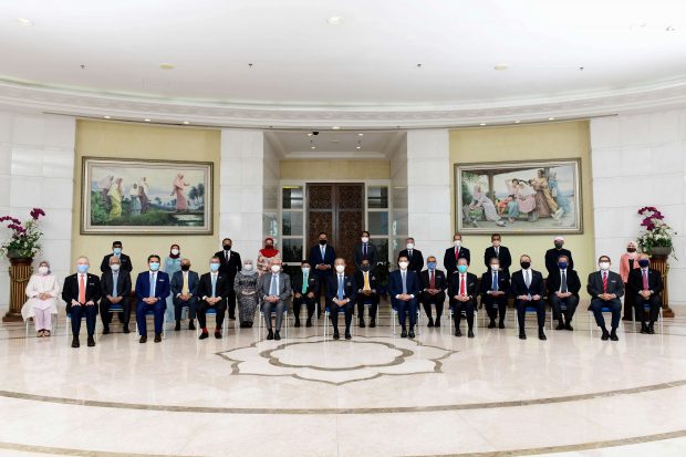 Malaysia's members of cabinet pose for a picture after a meeting in Putrajaya, Malaysia August 16, 2021. Malaysia Information Department/Handout via Reuters ATTENTION EDITORS - THIS IMAGE HAS BEEN SUPPLIED BY A THIRD PARTY. NO RESALES. NO ARCHIVES. MANDATORY CREDIT.