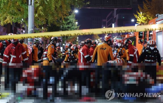 Rescuers move injured people in Seoul's Itaewon district