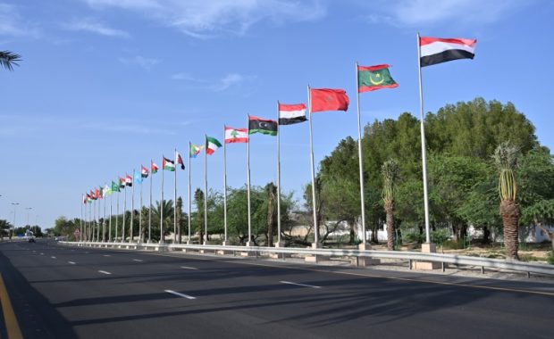 Flags of Arab countries edge a highway in Bahrain