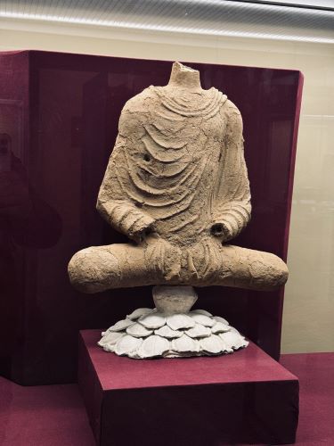 A Buddha statue sitting on a lotus flower excavated from Mes Aynak near Kabul. It is believed to have been created during the Kushan Empir’s Dynasty.