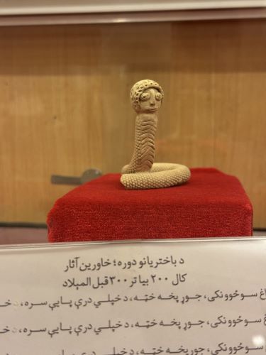 Snake sculpture on display at the Kandahar Museum. Due to the influence of Hellenism, the hair is curly. 