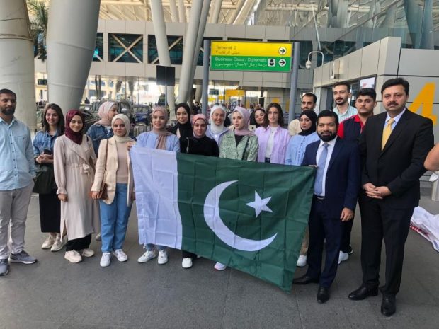 Photo, taken and released by Pakistan embassy in Egypt, shows first group of Palestinian students departing for Pakistan, in Cairo (1)